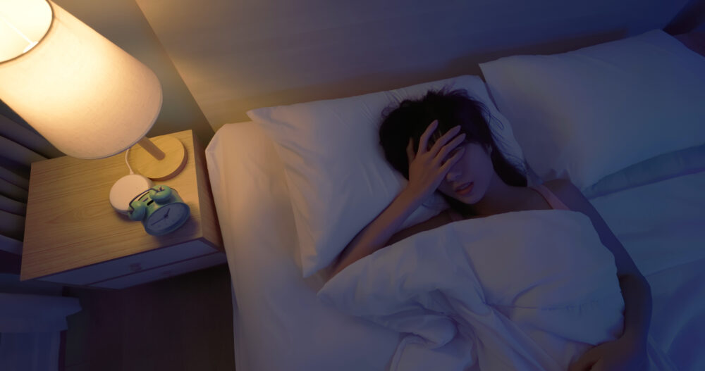 asian woman sleepless at night
